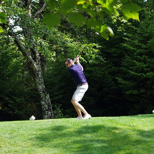 man taking a golf shot